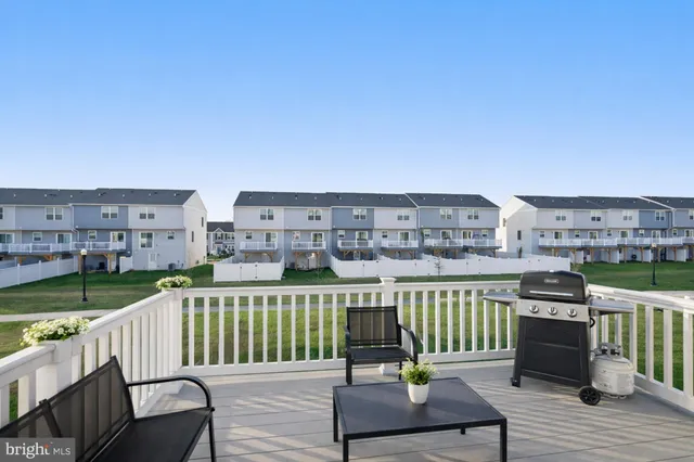 a view of a balcony with wooden floor