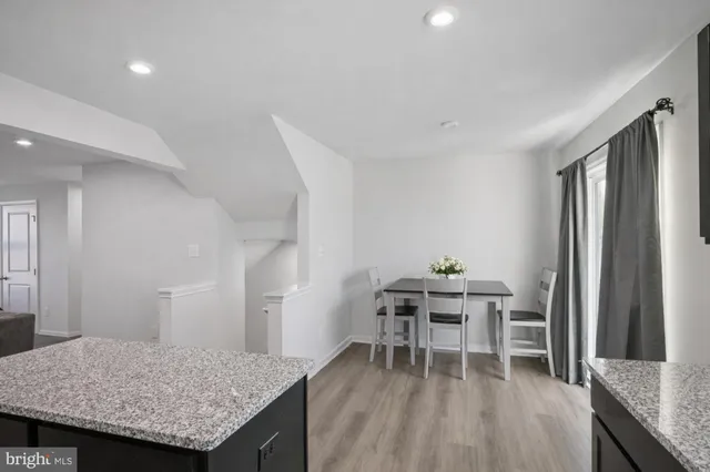 a dining room with a table and chairs