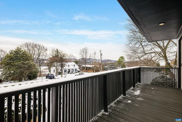 a kitchen with a table chairs sink and microwave