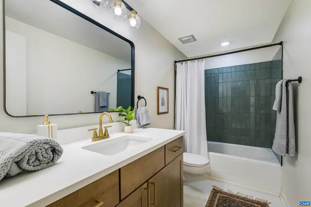 a view of a yard covered with snow in front of house