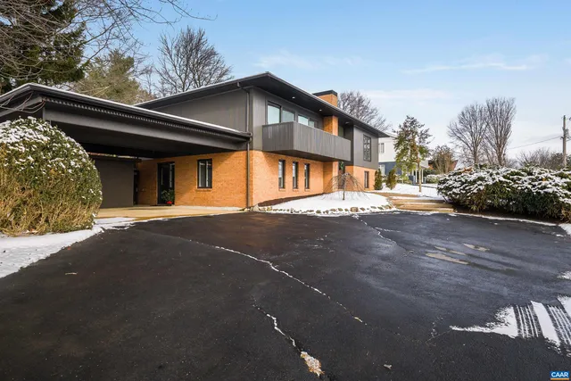 a view of staircase with white walls and wooden floor