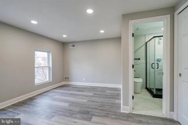 a view of entryway with wooden floor