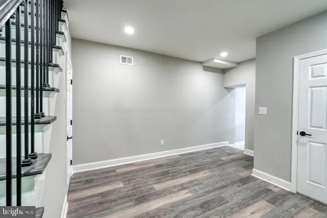 wooden floor in a hall with an entryway