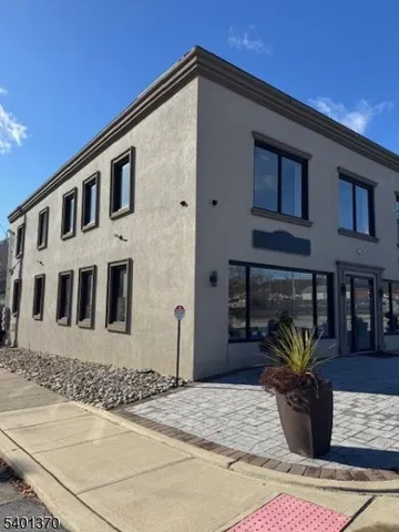 a front view of a house with glass windows