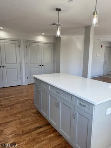a spacious bathroom with a double vanity sink and mirror