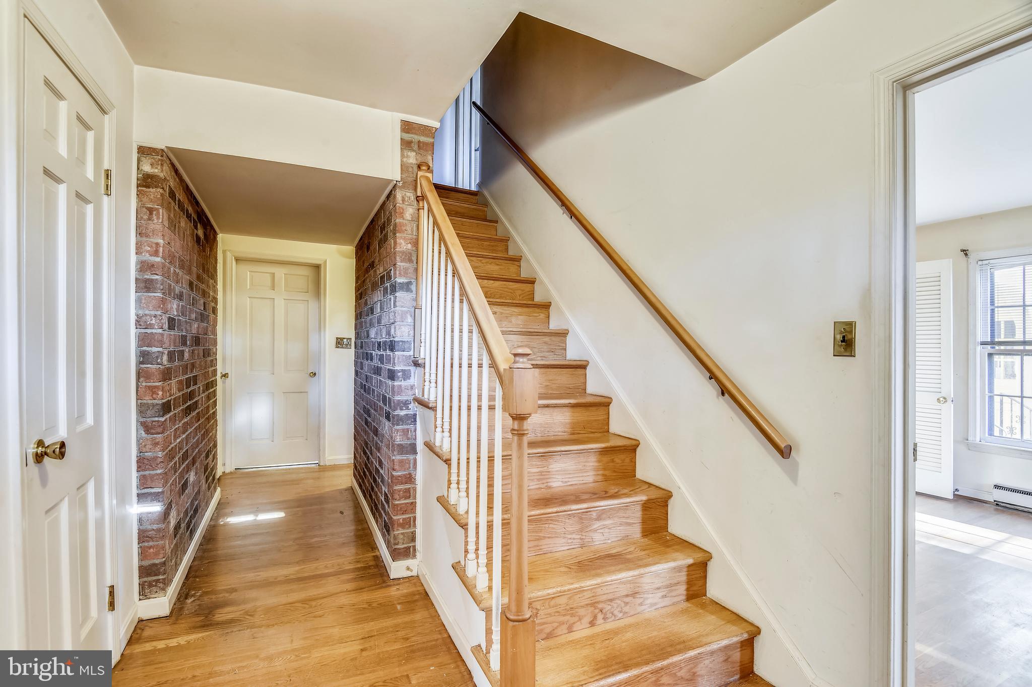 11342 Vale Road Oakton, VA 22124 - Photo 5 of 34 Beautiful Exposed Brick & Original HW floors
