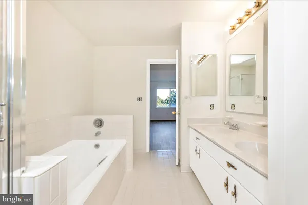 a view of a deck with a table and chairs next to a yard