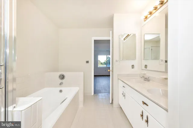 a view of a deck with a table and chairs next to a yard