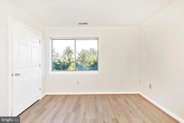 a view of a garden with a house