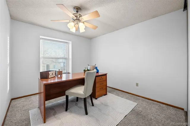 a workspace with furniture and window