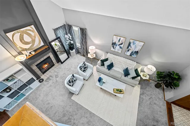 a view of living room with furniture and flowers