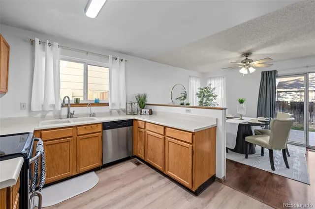 a kitchen with a stove a sink and a refrigerator