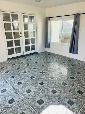 a view of an empty room with a window