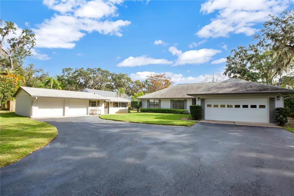 12805 Broleman Road Orlando, FL 32832 - Photo 1 of 1 a view of a house with a yard and large tree