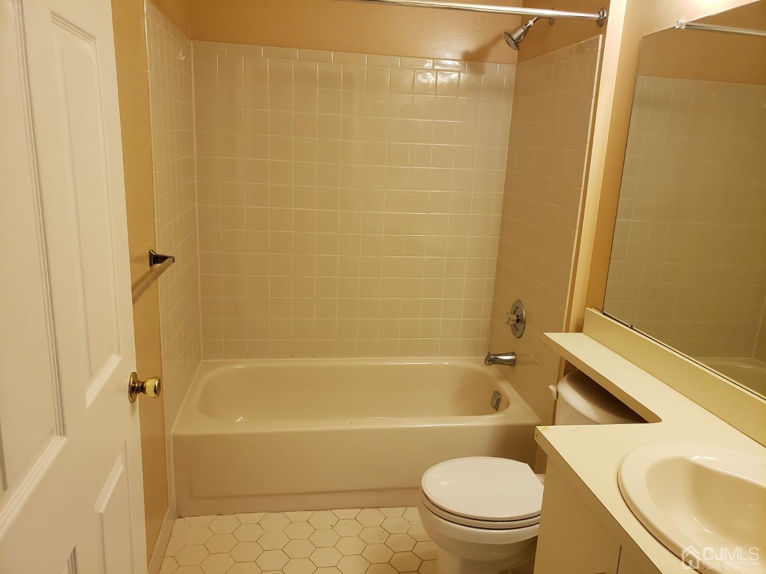 351 Wimbeldon Court North Brunswick, NJ 08902 - Photo 11 of 17 a bathroom with a sink and a toilet