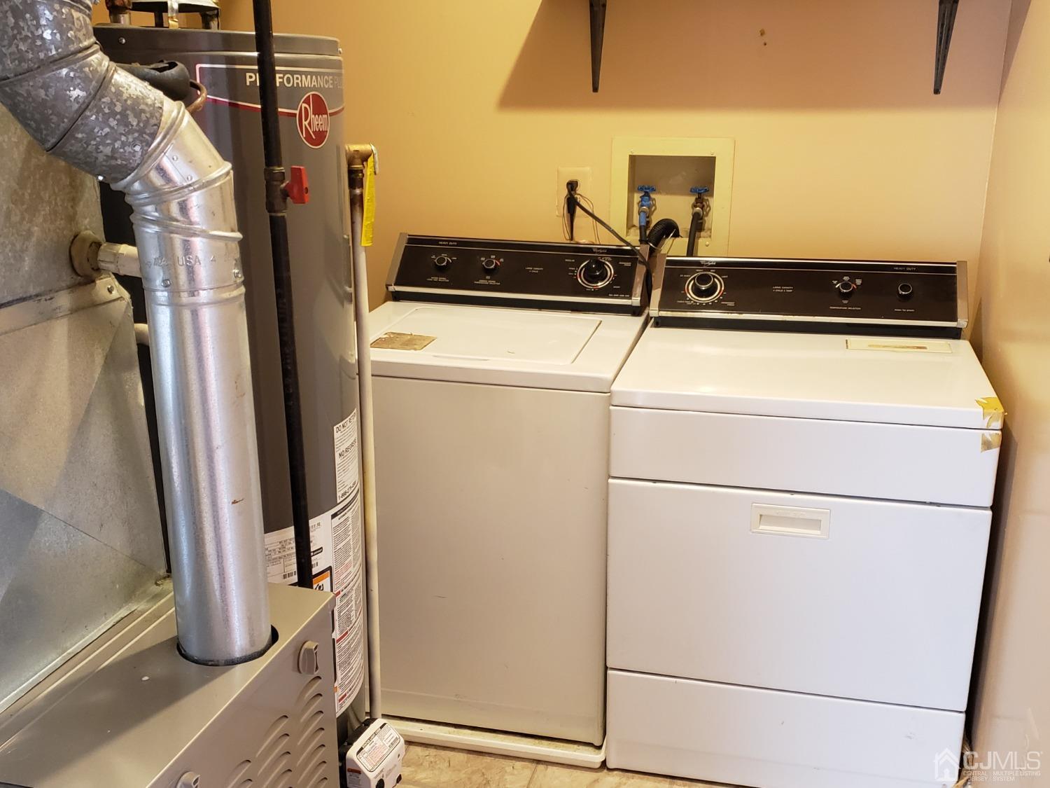 351 Wimbeldon Court North Brunswick, NJ 08902 - Photo 12 of 17 storage and utility room with washer and dryer