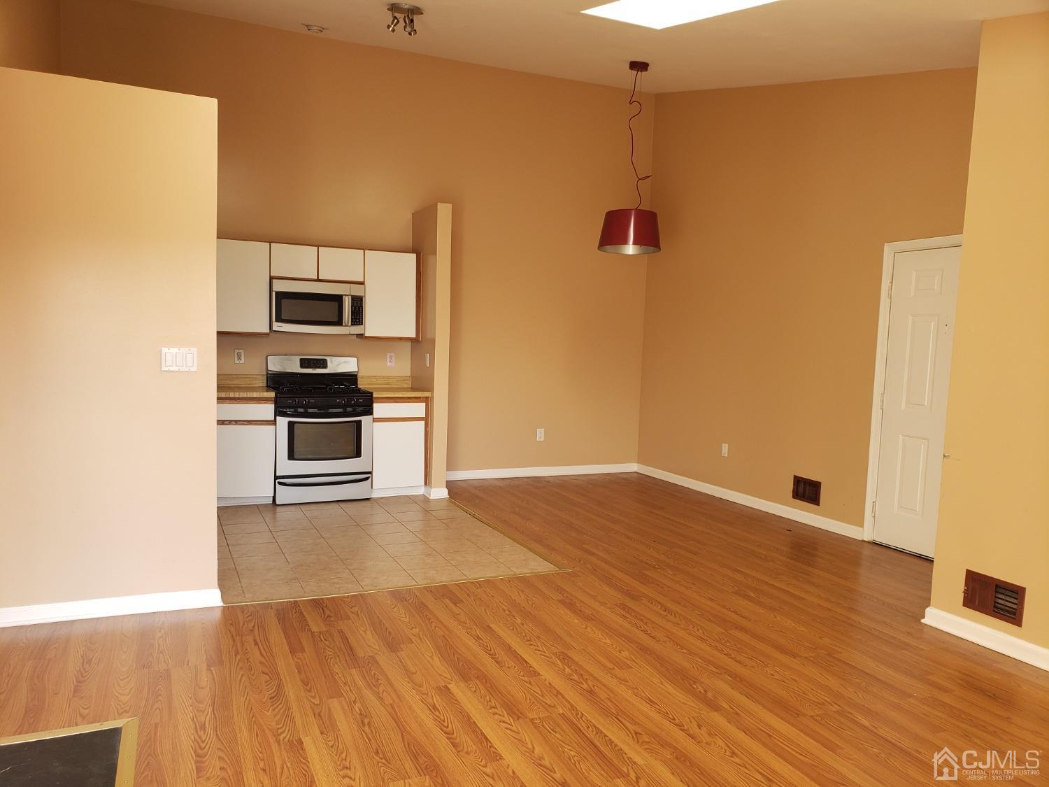 351 Wimbeldon Court North Brunswick, NJ 08902 - Photo 3 of 17 a view of kitchen with sink and refrigerator