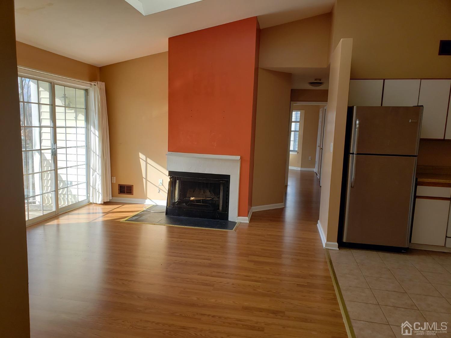 351 Wimbeldon Court North Brunswick, NJ 08902 - Photo 5 of 17 a view of a livingroom with a fireplace and a window