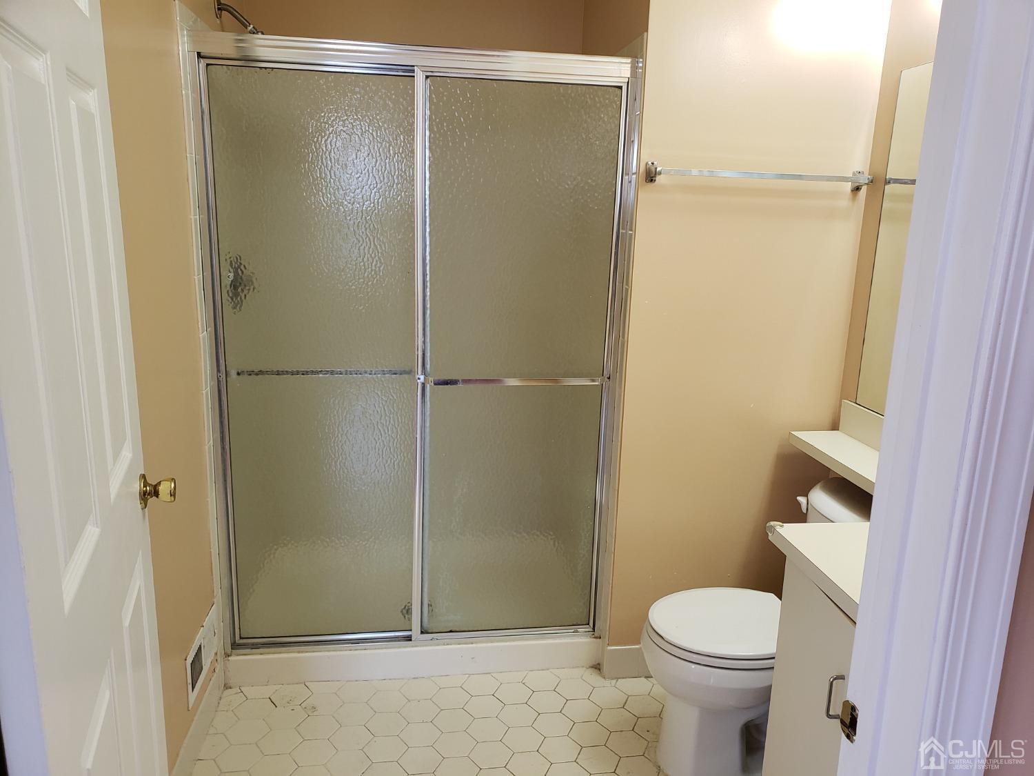 351 Wimbeldon Court North Brunswick, NJ 08902 - Photo 9 of 17 a bathroom with a shower and a toilet