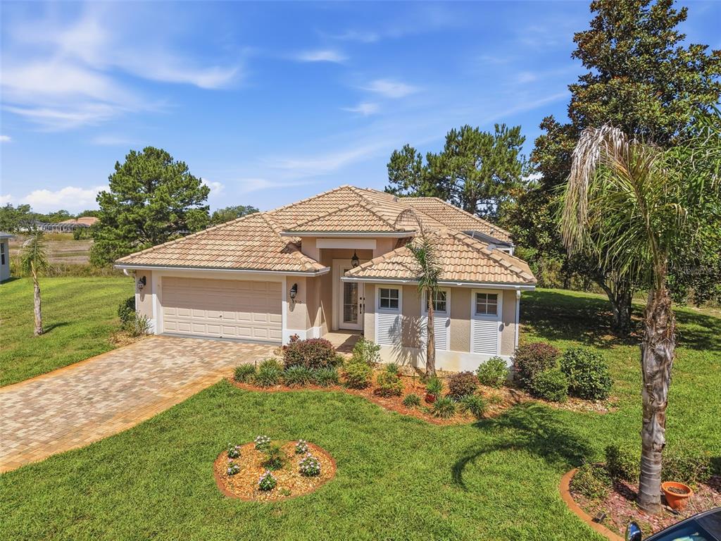 8910 Jericho Road Weeki Wachee, FL 34613 - Photo 48 of 52 a front view of a house with garden