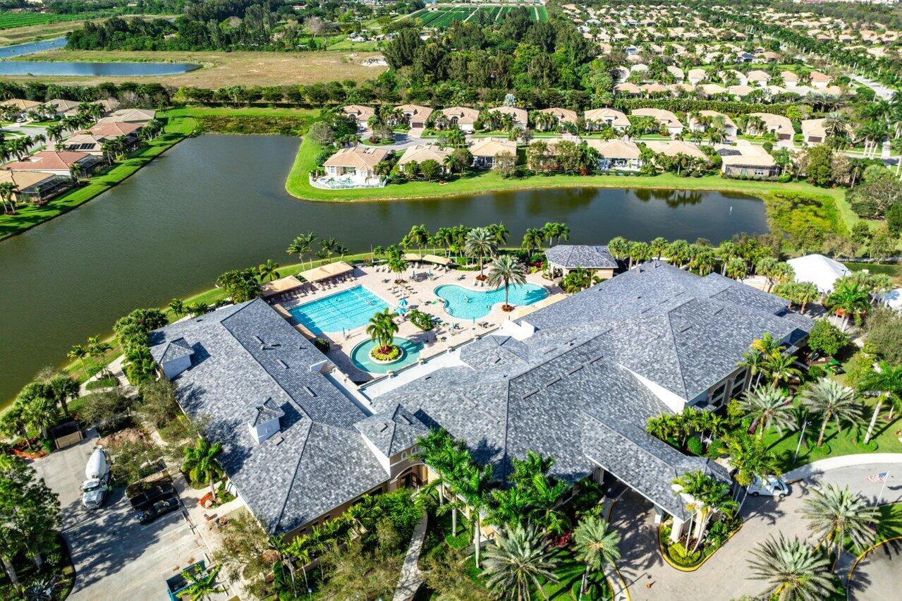 9385 Ivory Isle Road Boynton Beach, FL 33473 - Photo 28 of 50 an aerial view of a house with a lake view