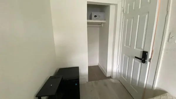 a view of closet with racks on the wall