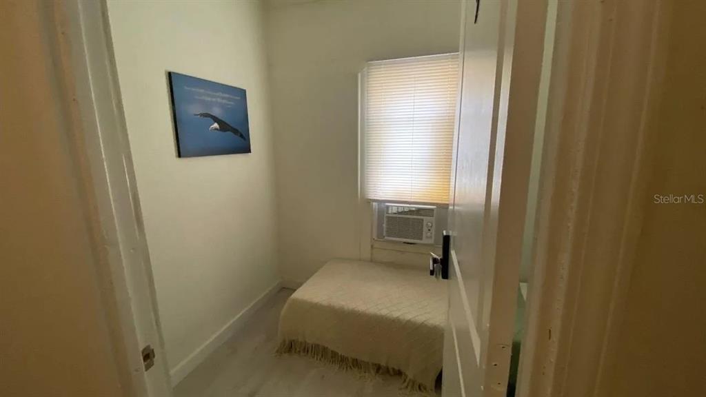 4427 Raleigh Street Orlando, FL 32811 - Photo 26 of 31 a bathroom with a sink and a mirror