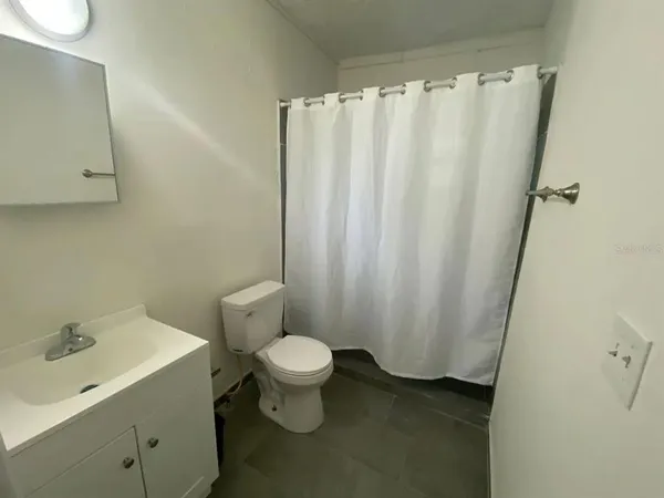 a room with a table and chairs