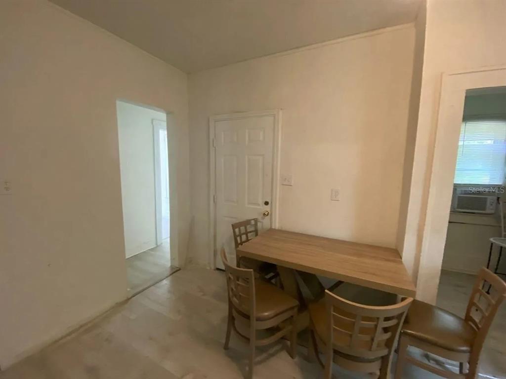 4427 Raleigh Street Orlando, FL 32811 - Photo 7 of 31 a room with a table and chairs
