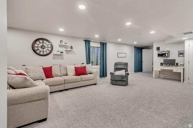 356 North 230 West Payson, UT 84651 - Photo 29 of 45 Spacious carpeted room featuring recessed lighting, multiple windows with teal curtains, built-in floating shelves, and a white paneled door