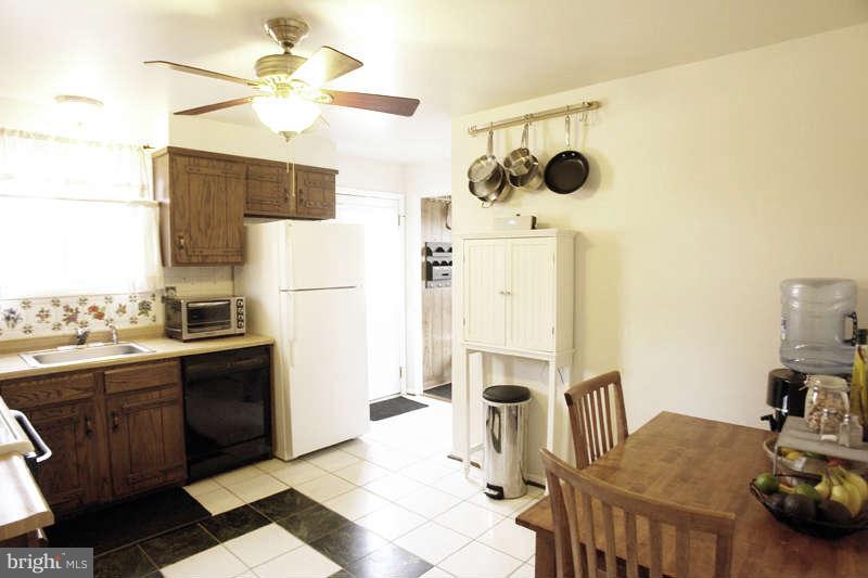 9505 Stewartown Road Gaithersburg, MD 20879 - Photo 11 of 30 Kitchen with side entry to deck & parking