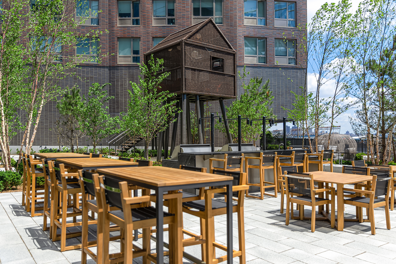 252 South Street, Unit 68C Manhattan, NY 10002 - Photo 63 of 70 a view of a patio with table and chairs and potted plants