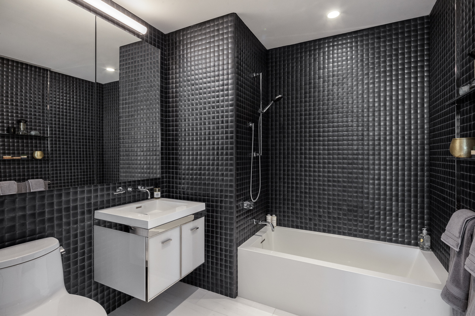 252 South Street, Unit 68C Manhattan, NY 10002 - Photo 9 of 70 a bathroom with a sink toilet and shower