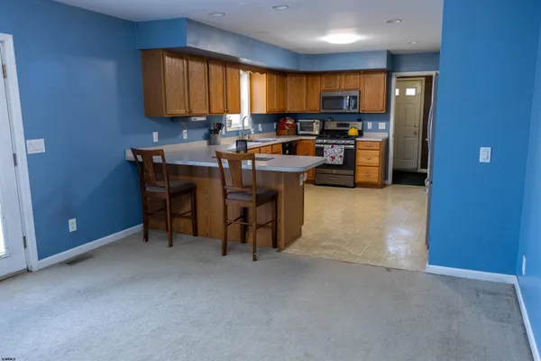 a kitchen with a sink cabinets and window