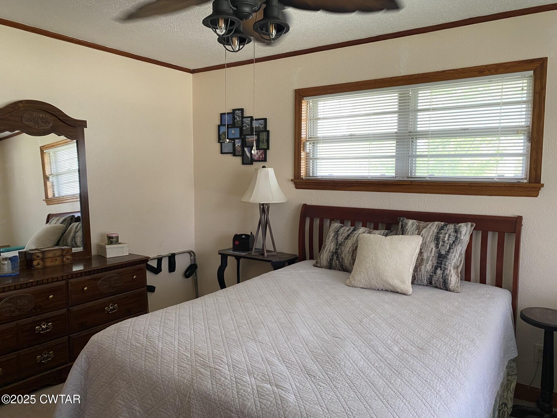 604 South Main Street Ridgely, TN 38080 - Photo 18 of 25 a bedroom with a bed and a dresser