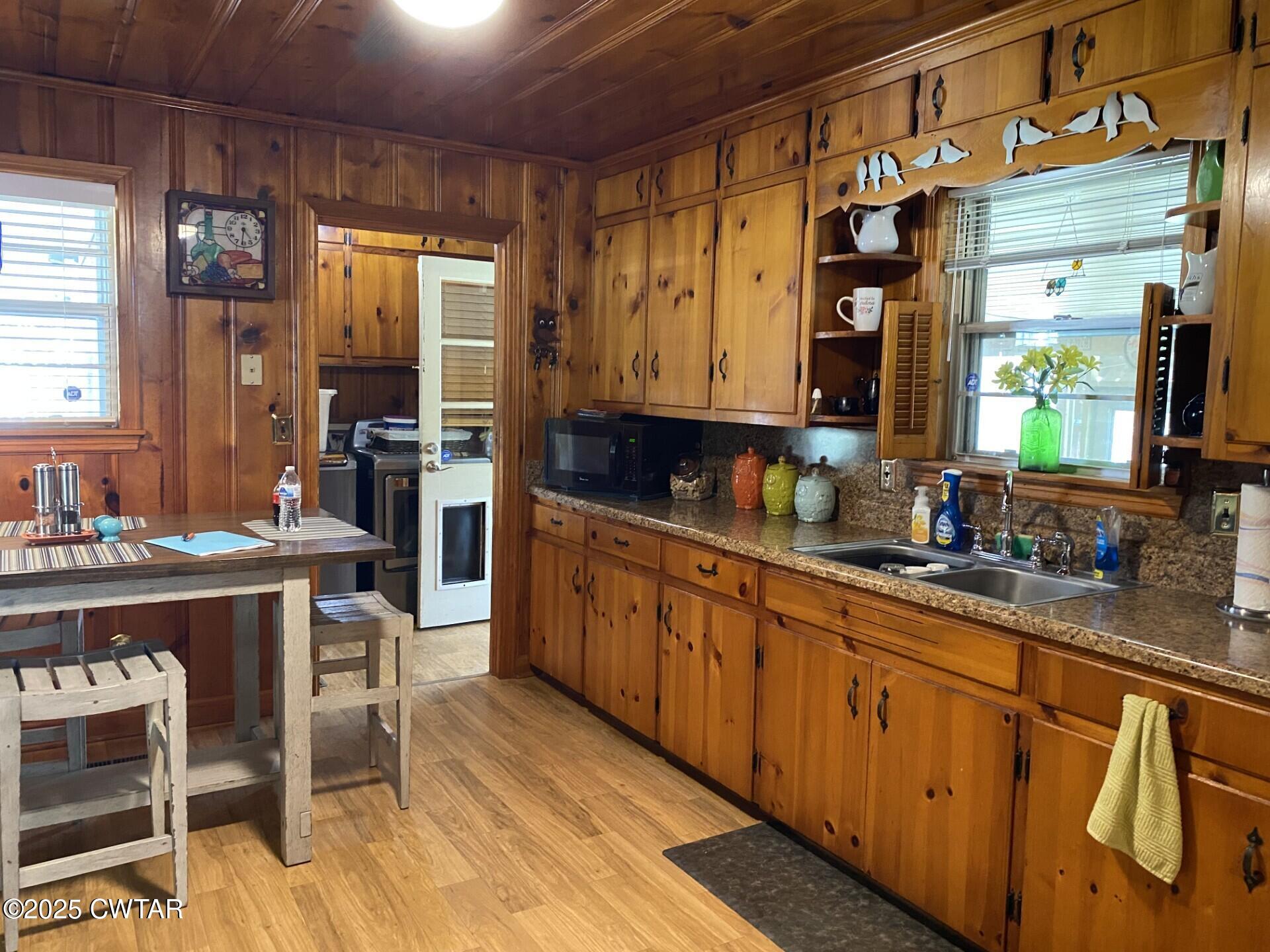 604 South Main Street Ridgely, TN 38080 - Photo 8 of 25 a large kitchen with kitchen island granite countertop a sink and cabinets