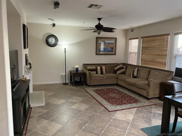a living room with furniture and a rug