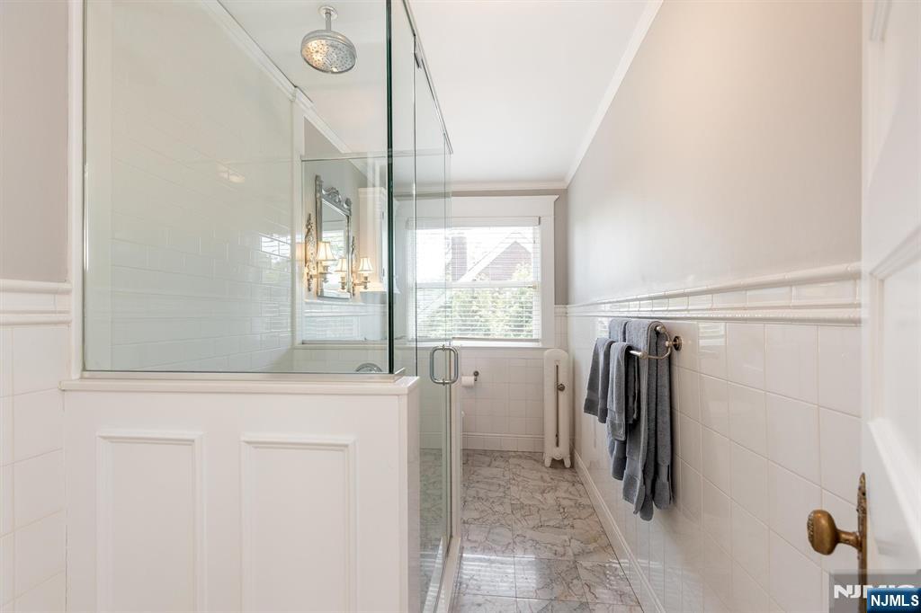 380 Ridgewood Avenue Glen Ridge, NJ 07028 - Photo 41 of 50 a bathroom with a bathtub and a shower