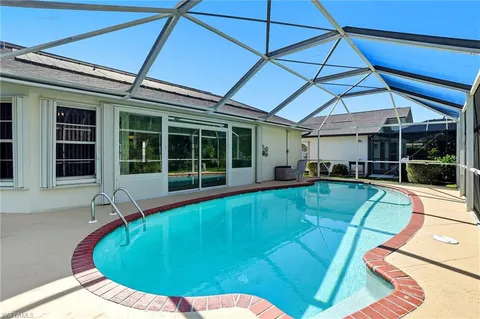 a view of a swimming pool with a patio