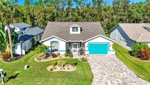 a front view of house with yard and green space