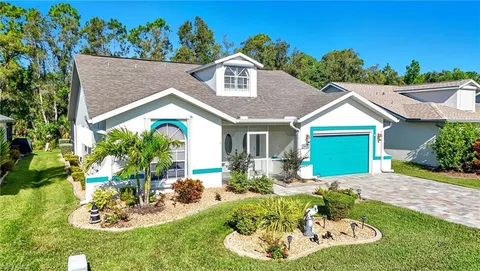 a view of a chairs and table in a patio