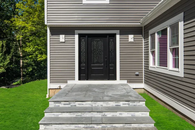 a front view of a house with a yard