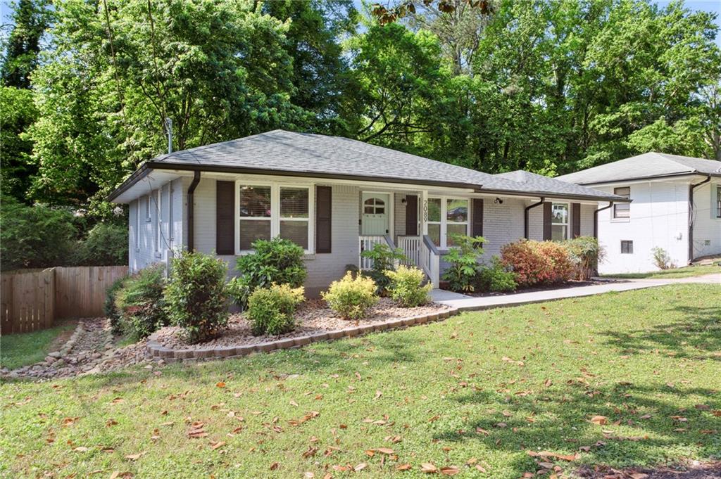 a front view of a house with garden