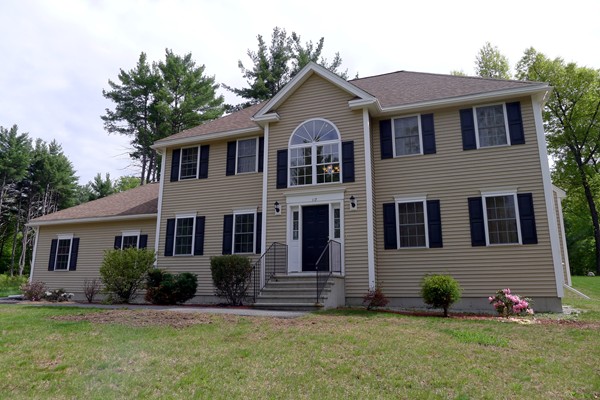 117 Tyler Road Townsend, MA 01469 - Photo 1 of 11 a front view of a house with a yard