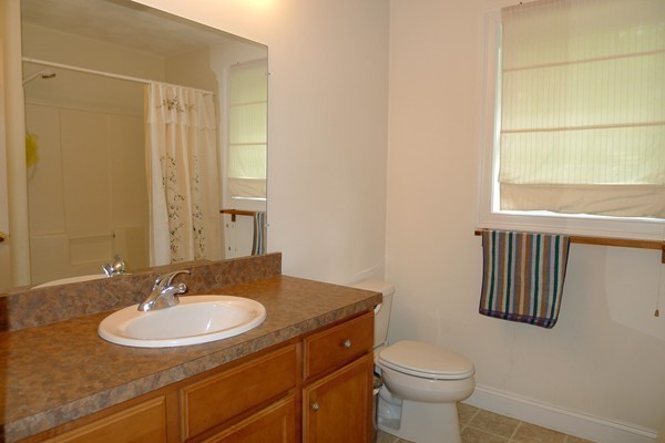 117 Tyler Road Townsend, MA 01469 - Photo 11 of 11 a bathroom with a sink toilet and a mirror