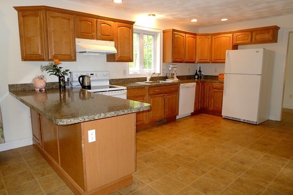 117 Tyler Road Townsend, MA 01469 - Photo 3 of 11 a kitchen with refrigerator and cabinets