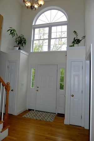 117 Tyler Road Townsend, MA 01469 - Photo 4 of 11 an empty room with wooden floor and windows