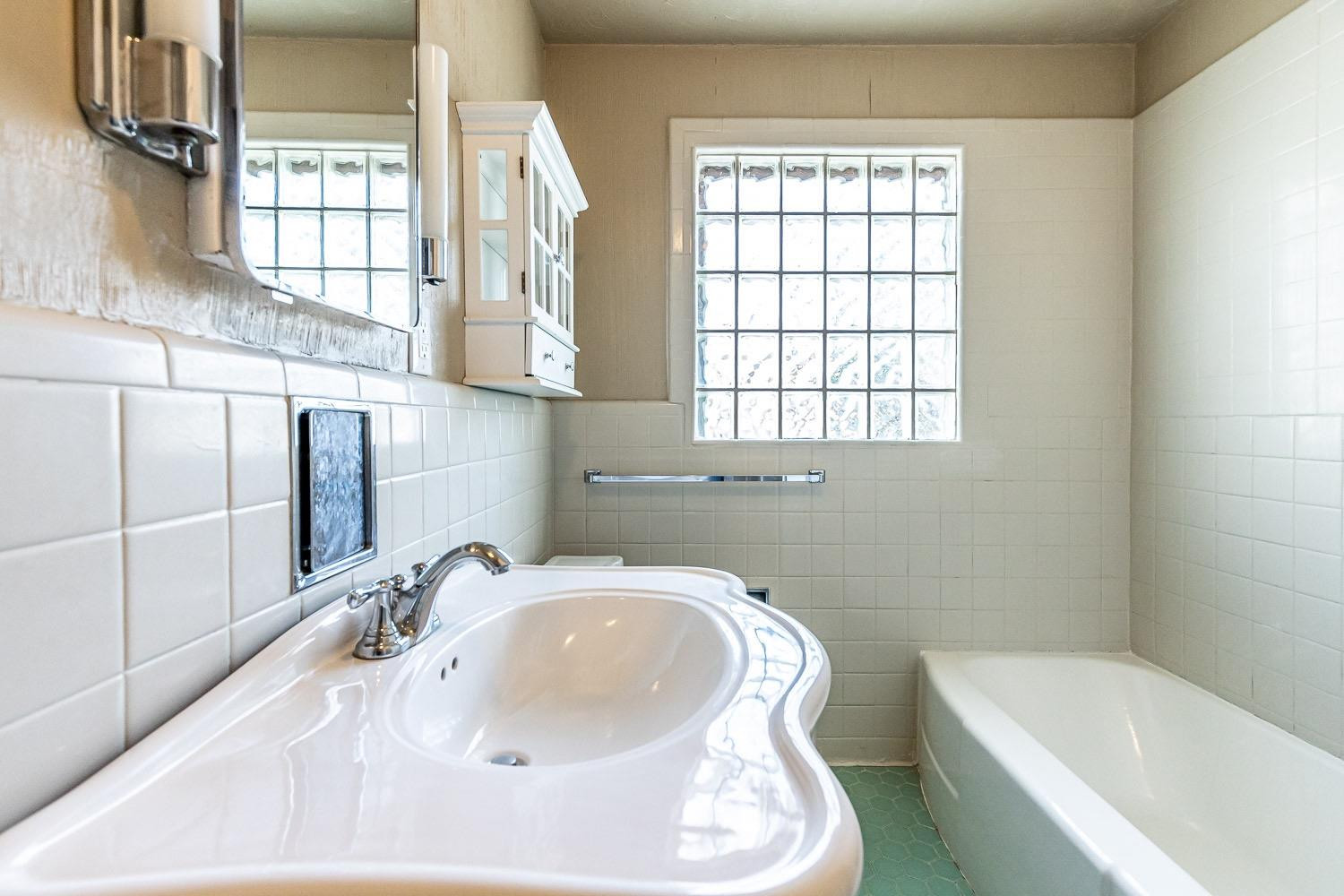 3708 27th Street Lubbock, TX 79410 - Photo 20 of 23 a bathroom with a sink and a bathtub