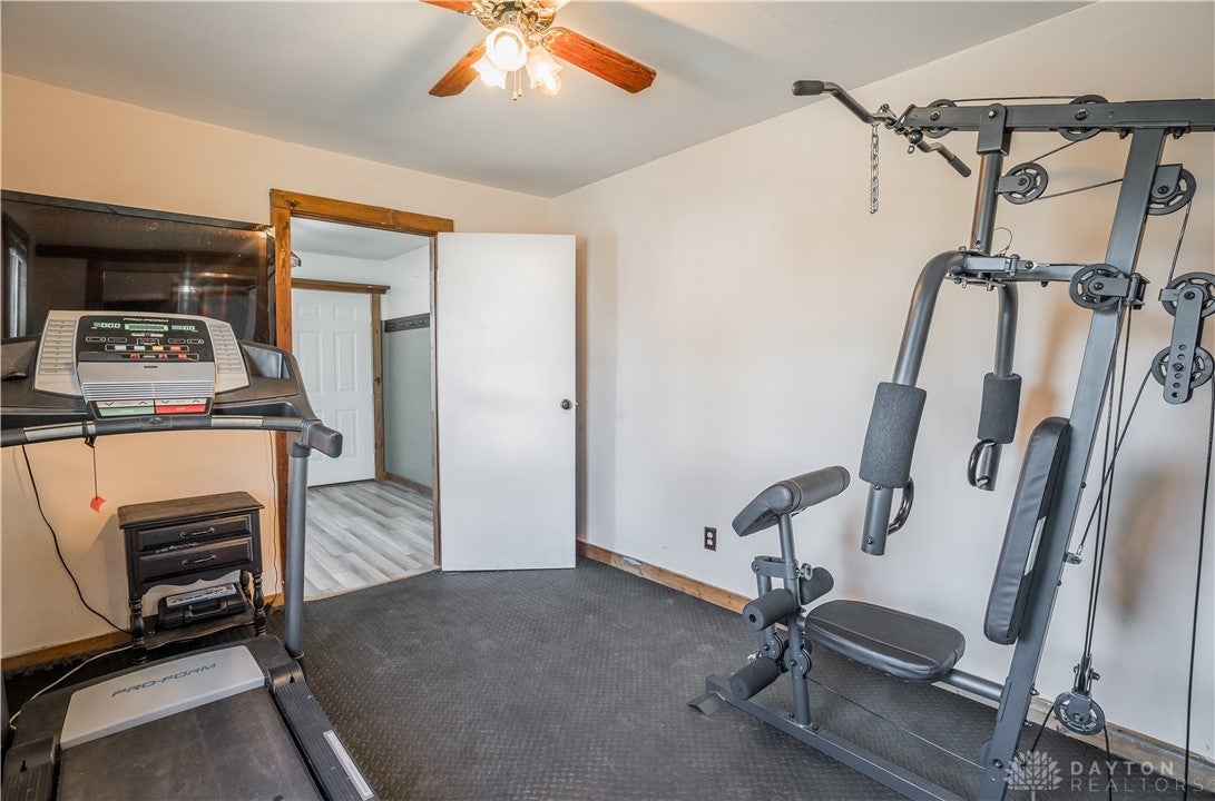 220 Racer Street Troy, OH 45373 - Photo 8 of 33 A bedroom serves as an inviting exercise room featuring durable flooring.