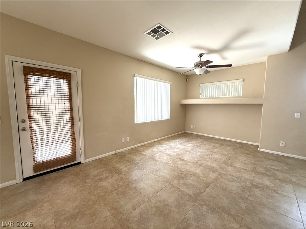 5942 Rampolla Drive Las Vegas, NV 89141 - Photo 4 of 27 A well-lit interior space with neutral tones awaits your personal touch.